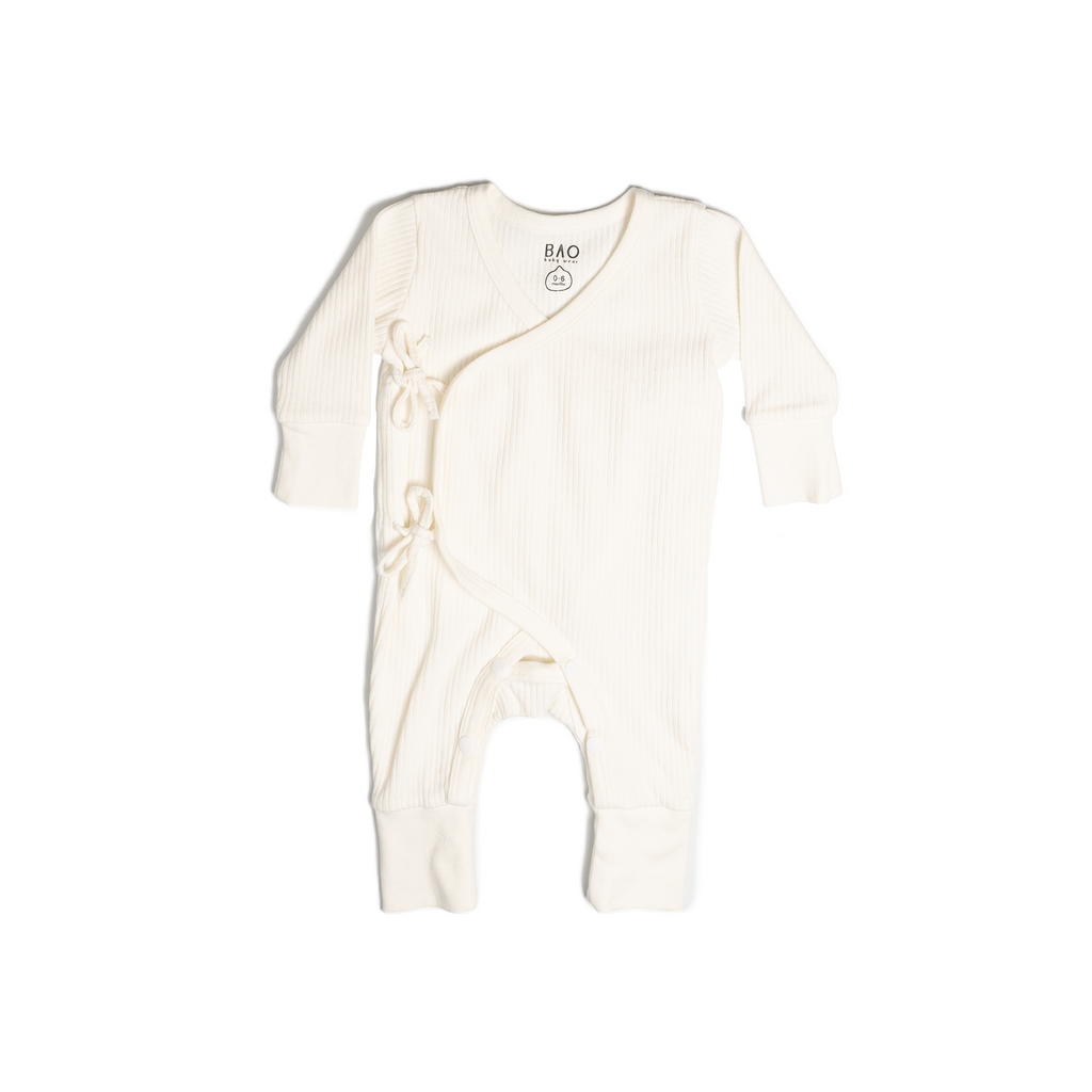 A set of kimono opening pyjamas in off white (vanilla). Made from ribbed cotton. Shown in its large setting.