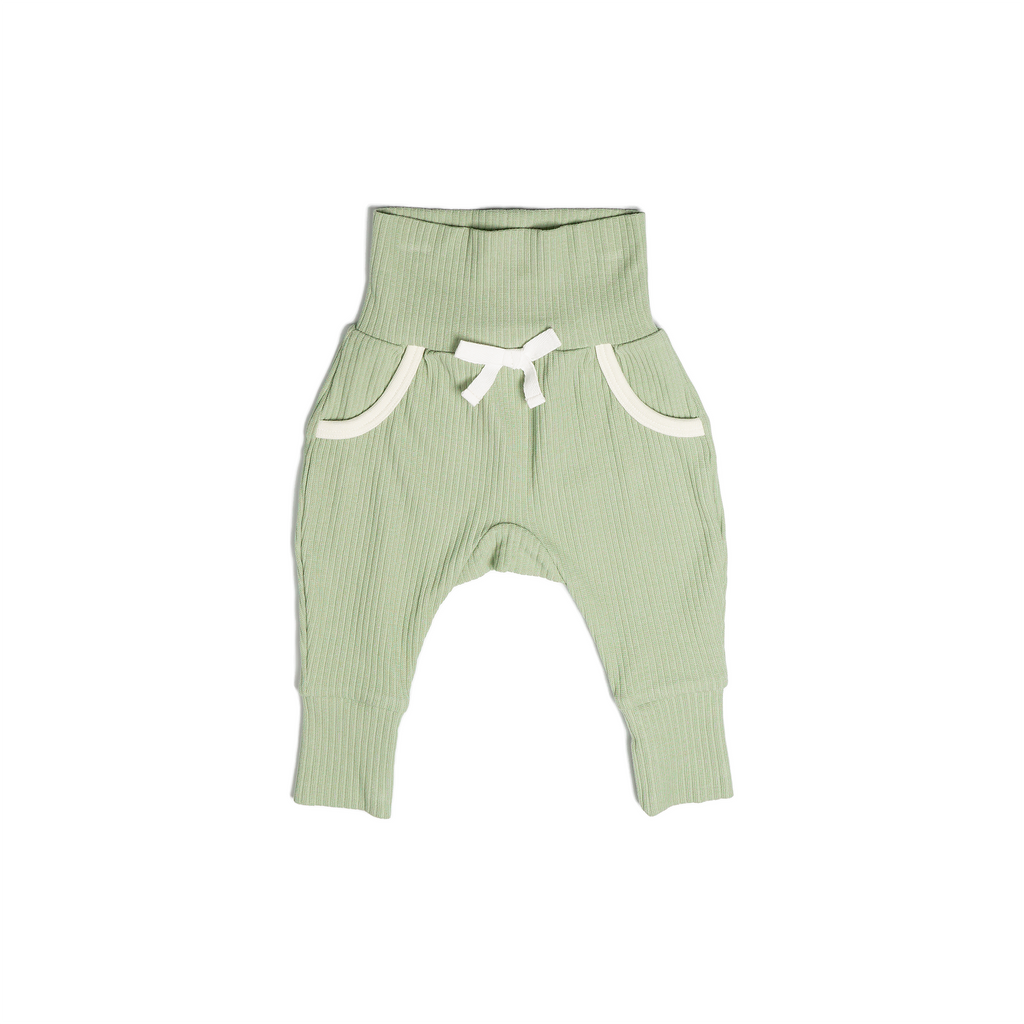 A pair of Lounge Pants in mossy green (matcha), made from a soft ribbed cotton. Shown in its large setting.