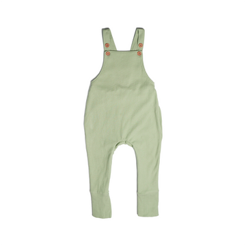 A set of overalls in mossy green (matcha), made from a soft ribbed cotton. Shown in its large setting.