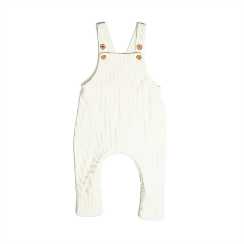 A set of overalls in off white (vanilla), made from a soft ribbed cotton. Shown in its large setting.