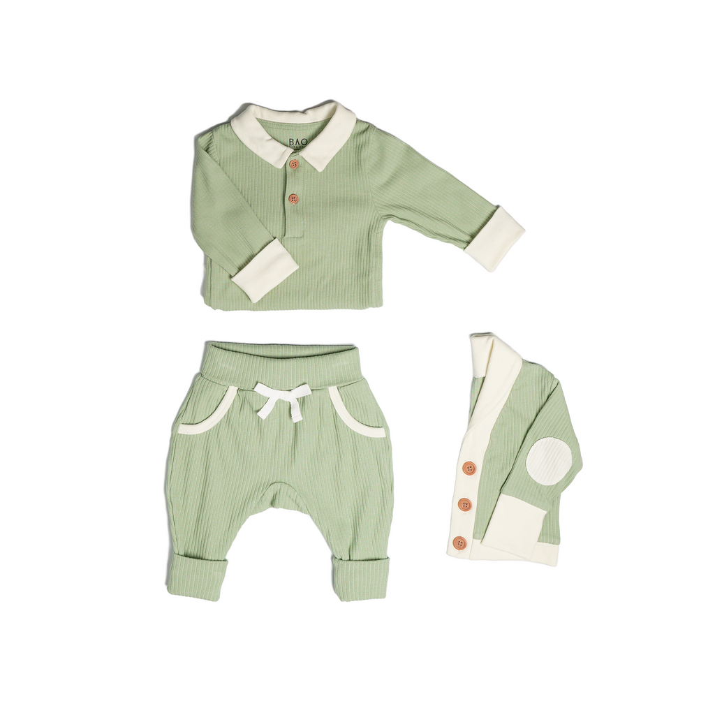 The toddler essentials bundle, consisting of a collared bodysuit in matcha ribbed cotton, paired with lounge pants in matcha and ribbed cotton and a cardigan in matcha ribbed cotton.