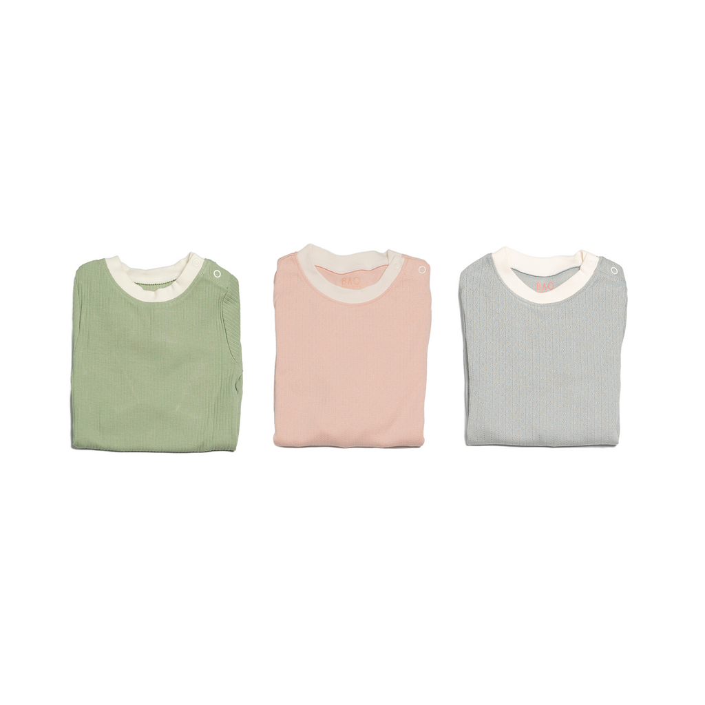 The toddler sleepy time bundle, consisting of 3 sets of pyjamas. One in ribbed cotton matcha, one in pointelle cotton butterfly pea and one in pointelle cotton peach.