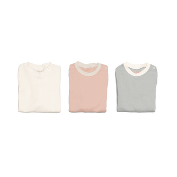 The newborn sleepy time bundle, consisting of 3 sets of pyjamas. One in ribbed cotton vanilla, one in pointelle cotton butterfly pea and one in pointelle cotton peach.