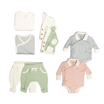 The ultimate earth-side bundle, consisting of a 2 sets of pointelle cotton kimono bodysuits, one in butterfly pea and one in peach, 2 pairs of ribbed cotton lounge pants, one in matcha and one in vanilla, 2 sets of ribbed cotton cardigans, one in matcha and one in vanilla, 2 sets of kimono pyjamas, one in ribbed cotton vanilla and one in pointelle cotton butterfly pea.